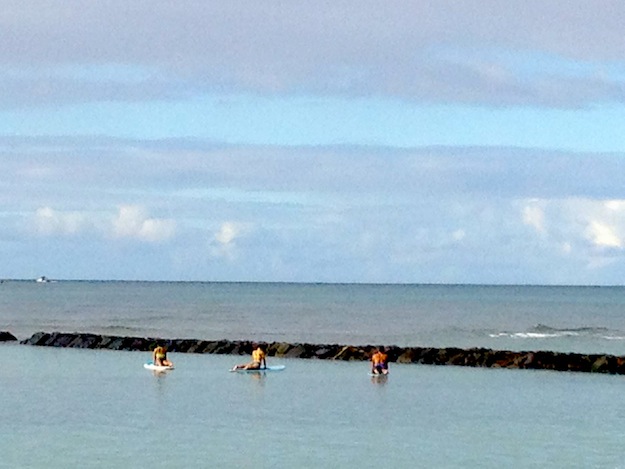 Yoga in the calm waters off Waikiki Beach